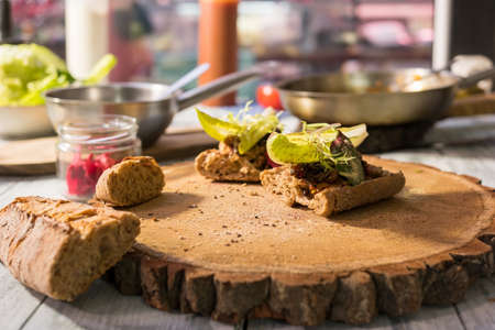 Onion and bacon jelly sandwiches. Food on wooden board.の写真素材