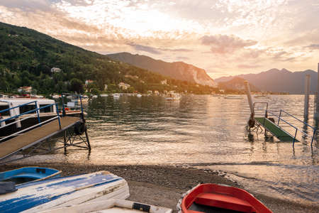 View of mountains from shore. Boats and buildings at distance. Spend vacation close to nature.の写真素材