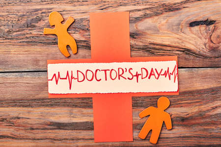 Orange stickmen and cross. Happy Doctors Day to cardiologist.