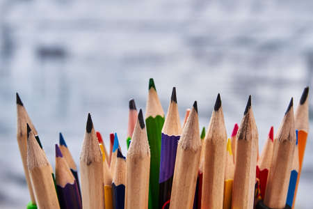 Colourful pencils on grey backdrop. Mood for drawing.の写真素材
