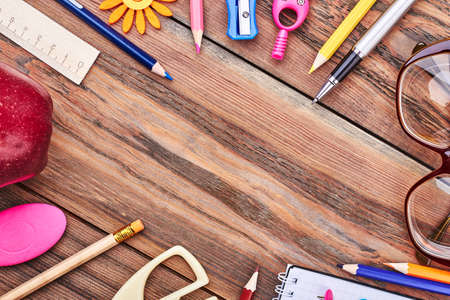 Stationery on wooden background. Empty space for your advertisement.の写真素材