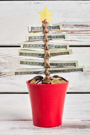Christmas tree from dollars. New year wish.の写真素材