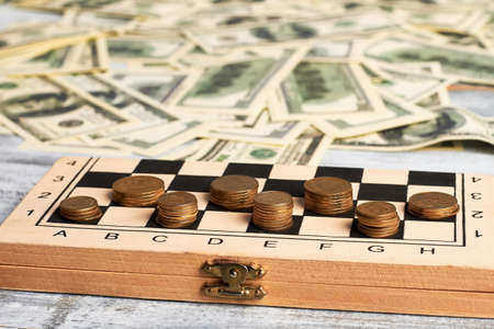 Stack of coins. Intellectual financial game. Checkers with coins.の写真素材