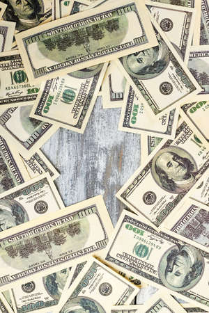Dollars on wooden surface. Empty space for your advertisement.の写真素材