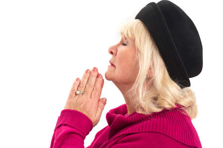 Side view of woman praying. Lady with closed eyes isolated.の写真素材