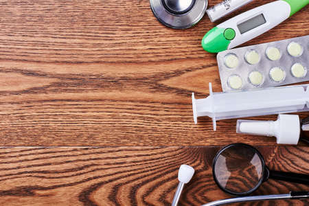 Thermometer, stethoscope, syringe and loupe. Medical instruments and aids. Check your health.の写真素材