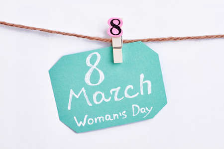 Card on white surface. Ladies day greeting.