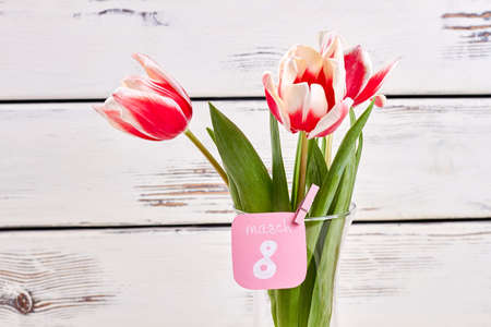 Tulips and card. Happy international womens day.