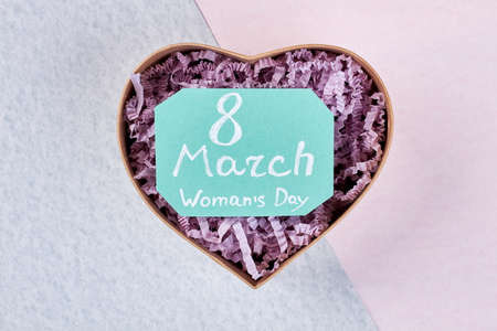 Heart-shaped box for a present. Congratulation with 8 of March.の写真素材