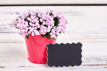 Bucket with flowers and card. Cute gift for woman.の写真素材