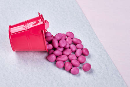 Fliped bucket with dragee. Tasty gift for beloved.の写真素材