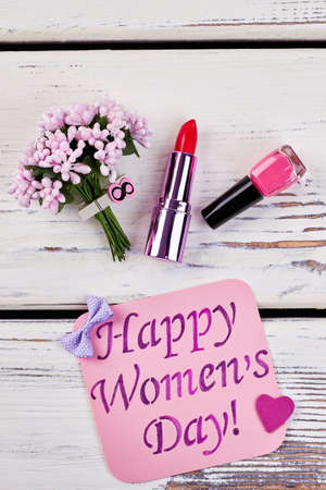 Lipstick, card and flowers. Wish joy for Womens Day.の写真素材