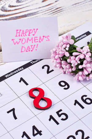Flower and calendar on wood. Congratulation with Womens day.の写真素材