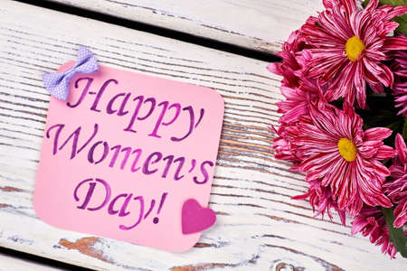 Heart, card and flowers. Best holiday gift for her.の写真素材