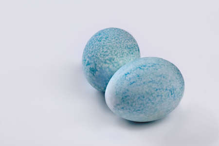 Blue dyed eggs. Colored chicken eggs isolated. Easter food ideas.の写真素材