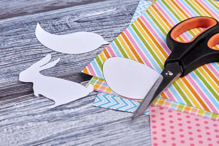 Papercut animalistic figures. Colorful paper sheet patterns. Easter holiday decorations.の写真素材