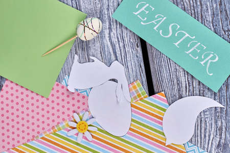 Papercut silhouettes and colorful sheets. Easter card and decor items. Easter creative ideas.の写真素材