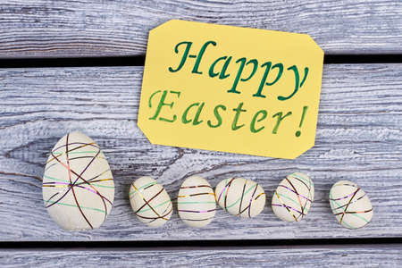 Happy Easter card, styrofoam eggs. Polystyrene eggs on wood. Holiday decor ideas.
