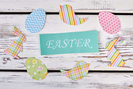 Paper cutouts and Easter card. Colorful rabbit and egg cutouts.