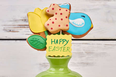 Three easter cookies, greeting card. Biscuits with colorful frosting.