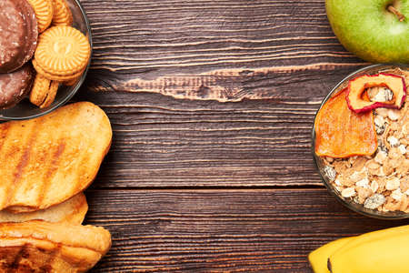 Bread, banana and muesli. Battle for healthy lifestyle.の写真素材