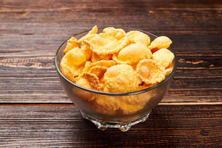 Cornflakes on wooden background. How to lose weight.の写真素材
