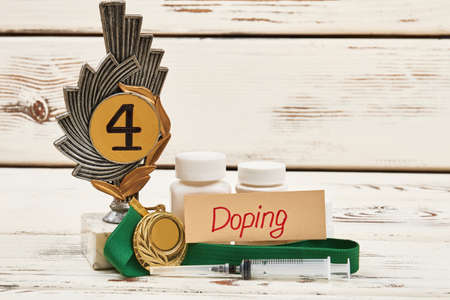 Awards, container and syringe. Doping sport concept.の写真素材
