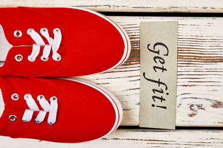 Gumshoes on wooden surface. Health benefits of running.の写真素材