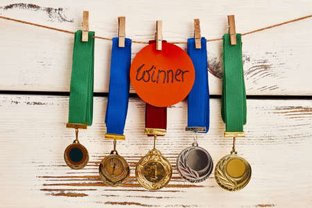 Medals in row. Success secrets to being a winner.の写真素材