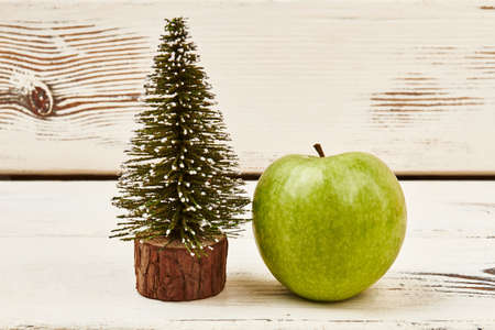 Fir-tree and apple on wood. Believe in your dreams.の写真素材