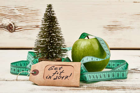 Christmas tree on wooden surface. New year and new beginning.の写真素材