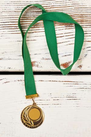 Sports medal on wooden background. Follow your dreams.の写真素材