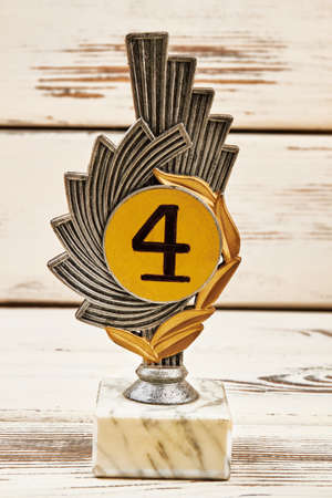 Award on wooden surface. Willpower is key to success.の写真素材