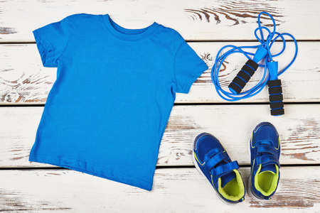 T-shirt, skipping rope and sneakers. Positive body transformation.の写真素材