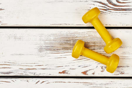 Dumbbells on wooden background. Your only limit is you.の写真素材