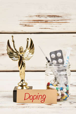 Drugs and award. Artificial stimulation of physical activity.の写真素材