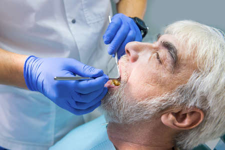 Procedure of dental examination. Doctor at work.の写真素材