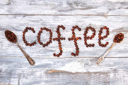 Rusty vintage spoons, wooden background. Coffee decoration on grey table. Be creative and energetic.の写真素材