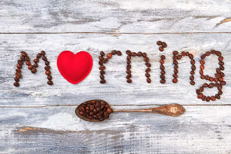 Affection to coffee, heart, spoon. Word morning on wooden table. Decorating with old time spoon.の写真素材