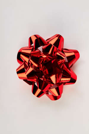 Red Christmas bow isolated. Festive bow on white background.