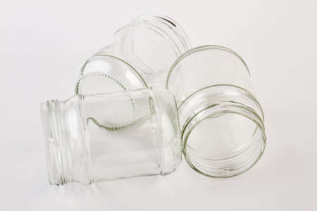 Three jars isolated on white. Empty clean jars for jam canning.の写真素材