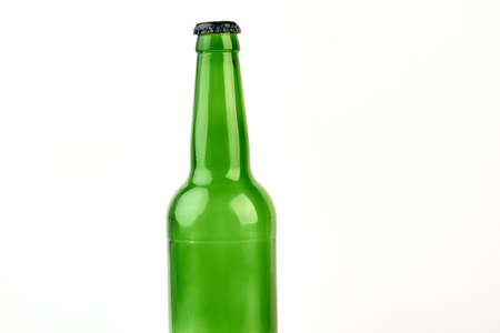 Empty bottle for beer isolated. Green glass bottle, white background.の写真素材