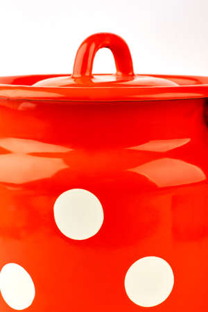 Cropped picture of red jug. Cooking pot on white background.の写真素材