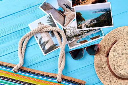 Still life of summer vacation. Headgear, sunglasses, handbag, different photos, blue background.