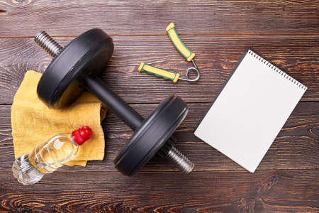 Sport equipment, notebook with copy space. Get fit and note sport results.の写真素材