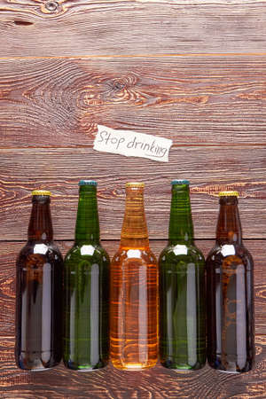 Group of bottles with alcohol beverage. Concept of alcoholism, retro background.の写真素材