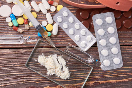 Ampoules, powder, syringe, pills, glass. Set of narcotic preparations.の写真素材