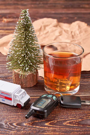 Whiskey, car key, ambulance emergency, paper. Booze driving concept.の写真素材