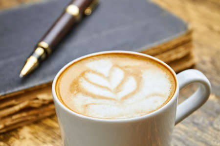 Cup of latte macro. Coffee with foam art.