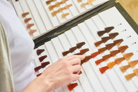 Hair color swatches chart, hand. Dyed hair samples.の写真素材